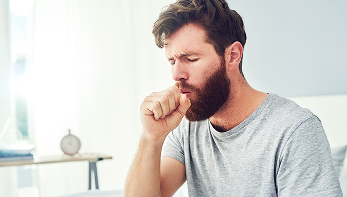 A man coughing A man coughing